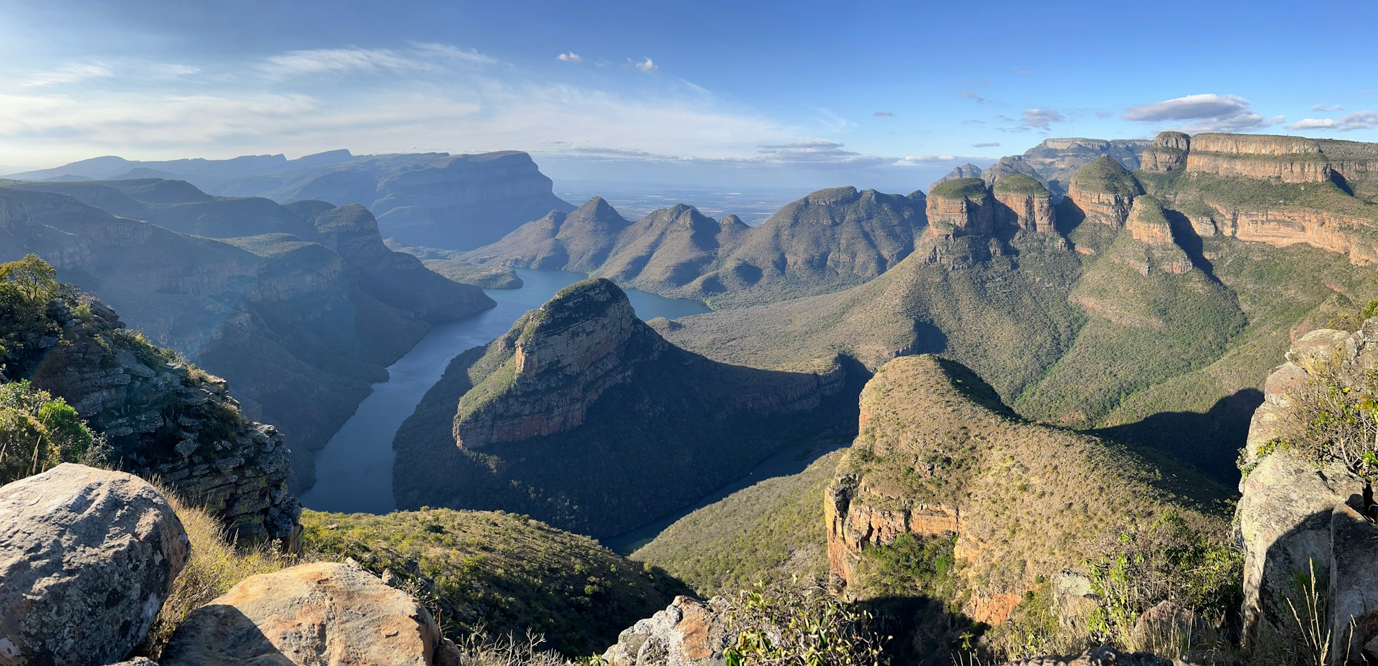 Green cliffs and winding water in Blyde River Canyon